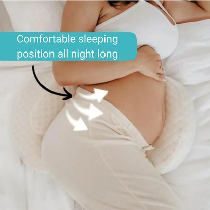 Pregnant woman using a maternity cushion for pregnancy support and postpartum relief