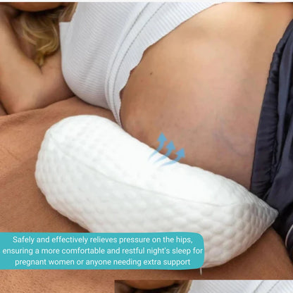 Pregnant woman using a maternity cushion for pregnancy support and postpartum relief