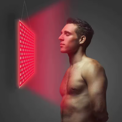 Person using red light therapy for muscle recovery