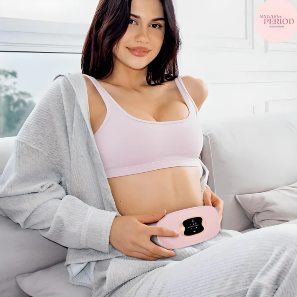 Woman using a warming waist belt for menstrual pain relief and abdominal massage.